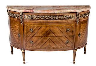 * An Italian Gilt Metal Mounted Bookmatch Veneered Commode Height 35 x width 56 1/4 x depth 20 inches.