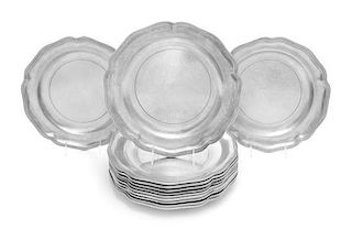 * A Set of Twelve Pewter Chargers Diameter 12 inches.