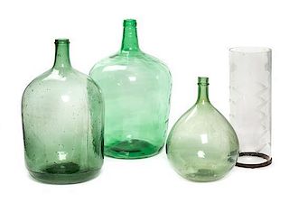 * A Group of Three Blown Glass Wine Jugs Height of tallest 22 inches.