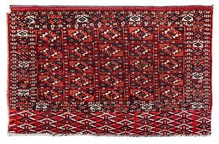 * A Turkoman Wool Rug 3 feet 10 inches x 2 feet 2 inches.
