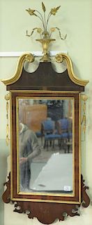 Federal mahogany mirror with gilt urn of flowers and pediment having mirror surround, early 19th century.    Provenance: Esta