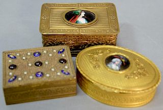 Three French enameled boxes including an oval gilt box with an enameled copper portrait, a rectangular box with an oval ename