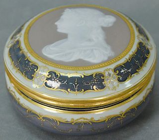 Meissen pate-sur-pate covered circular porcelain box with gilt decoration and finely painted in white slip with a bust of a w