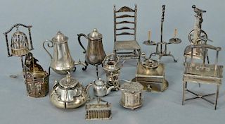Fourteen miniature silver dollhouse tableware and furniture group to include a chair, table press, birdcage with stand, adjus
