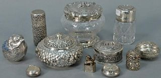 Group of silver to include six small boxes, reticulated container, repousse box, two jars with silver tops, and a figural bir