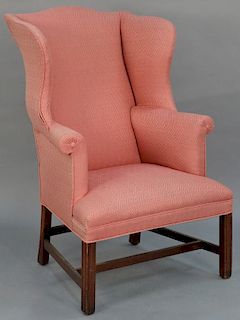 Chippendale mahogany upholstered wing chair set on molded square front legs with stretcher base, circa 1780.  (rear legs ende