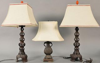 Three bronze lamps to include a pair of Japanese bronze table lamps, each capped with carnelian red finials along with a bron