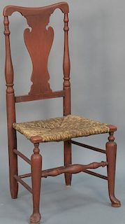 Queen Anne side chair with rush seat and turned legs ending in pad feet in old red paint, circa 1740. 
seat height 41 inches
