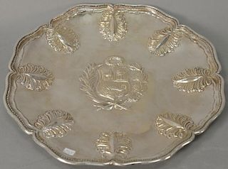 South American sterling silver sideboard dish, probably Peru, center chased with an armorial emblem within a foliate wreath, 