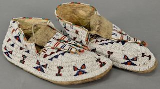 Pair of American Indian beaded moccasins, probably late 19th century. 
length 10 inches