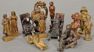 Group of twelve miniature bronzes to include five wax seals, cold painted man sitting in chair and woman sitting in a chair, 