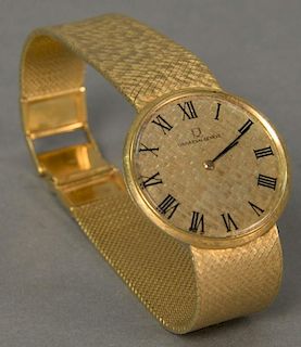 Universal 18K gold mens wristwatch with 18K gold mesh band, marked on dial: Universal Geneva.
(stem cap missing) 
total weigh