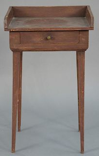 Primitive one drawer stand with gallery back all on square tapered legs, early 19th century. 
total height 27 1/2 inches, wid