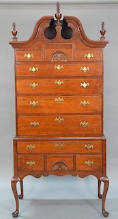 Queen Anne highboy in two parts, upper portion with full bonnet top over fan carved center drawer flanked by two short drawer