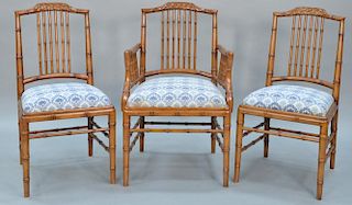 Set of fourteen faux bamboo dining chairs, each with lattice top rail, bamboo style turnings, and upholstered slip seats on b