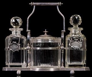 A BRIGGS & CO SILVER PLATED TANTALUS WITH CRYSTAL