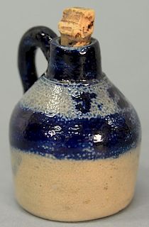 Miniature stoneware jug marked with cobalt blue J.T. and cobalt blue handle.  height 3 1/4 inches  Provenance: Estate of Dr. 