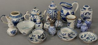 Twenty miniature blue and white porcelain pieces including three dollhouse vases, three double gourd vases, two tea boxes, tw