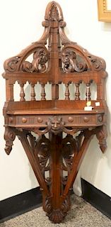 Victorian walnut hanging corner shelf with carved lion face. height 37 inches