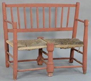 Primitive wagon bench with large turned center leg.  height 31 inches, width 39 inches   Provenance: Estate of R. Donald Bass