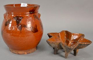 Two piece lot to include a redware crock with slip decoration and two handles and a redware star mold (foot chips). 
crock: h