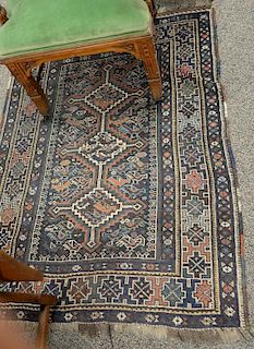 Oriental throw rug. 
3'10" x 5'4"