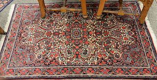 Oriental throw rug. 
3'5" x 5'2"