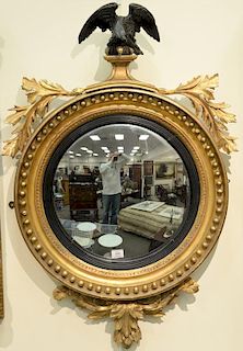 Federal gilt convex mirror with black eagle, early 19th century. 
height 43 inches