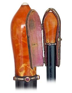 1. Amber Dress Cane -Ca. 1890 -Large natural Baltic amber knob turned in a straight and slightly tapering shape and set at th