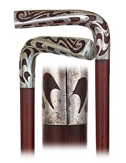22. Art Nouveau Silver Cane -Ca. 1900 -This cane is entirely fashioned of a single piece of well-figured and richly colored r