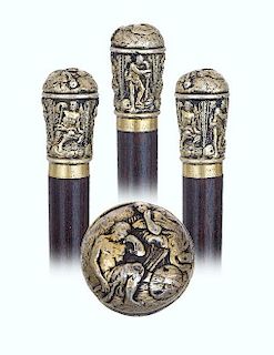 54. Early Dress Cane -Ca. 1830 -Heavy silver gilt knob well-modeled, cast and finely hand chased in the taste of the antic wi