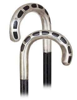 60. Art Deco Silver Cane -Ca. 1920 -Large and plain silver crook handle embellished with flush set ebony inlay, ebony shaft a