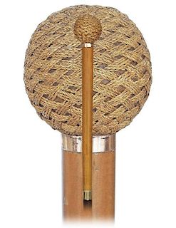 102. Macramé Day Cane -Ca. 1900 -Straight handle consisting of a wood ball entirely covered with macramé and a malacca stem