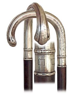 122. Silver Dress Cane -Ca. 1890 -Silver crook handle in a hexagonal configuration extending in a widening and rounded front