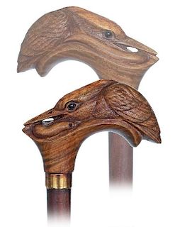 129. Kingfisher Cane -Ca. 1920 -Large flamed wood handle carved as a kingfisher with glass eyes and an eel-like fish in its l