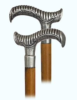 140. Alpacca Day Cane -Ca. 1900 -Large Opera shaped white metal handle chased with decorative elements and rounded and repeat