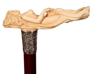 81. Mammoth Nude Cane- 20th Century- A high relief, full frontal reclining nude, signed sterling ornate collar, snakewood sha