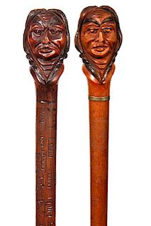 84. Two Dartmouth Indian Canes- Early 20th Century- a nice pair of carved Native Americans, one with a collar and one without