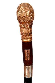 86. Ornate Dress Cane- Late 19th Century- A gold-filled high relief handle which is signed “Lyon,” side presentation plaq