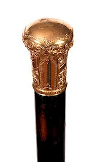 87. Gold Dress Cane- Ca. 1900- An ornate gold-filled dress handle with three empty presentation panels, thick ebony shaft and