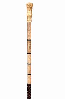 90. Bone Dress Cane- Ca. 1880- A carved bone handle which has a piece of mother of pearl atop, segmented bone upper section w
