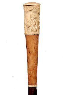 93. Bone Puti Dress Cane- Ca. 1820- A high relief carved handle with four Puti figures and a large fruit tree, burl upper spa