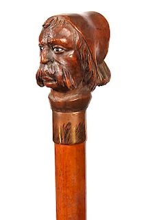 145. European Portrait Cane- Ca. 1890- A unique carving of a gentleman with a gigantic mustache and a fez hat with tassel, tw