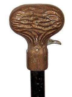 155. Cap Gun Cane- Early 20th Century- A cast one piece handle with working trigger and mechanism, a nice child’s cap gun c
