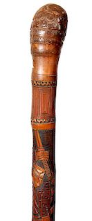 166. Fishing Pole Cane- Ca. 1930- A large carved bamboo shaft with various Japanese men and soldiers, root handle and a rubbe