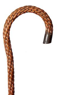 167. Nautical Rattan Cane- Ca. 1880-A woven rattan covering on an iron center section with a metal endcap and a 3” metal fe