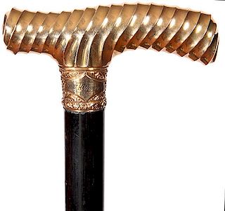 169. Gold Dress Cane- Ca. 1890- The gold-filled ornate handle of “Dr. Whwunder” , an unusual swirl pattern has been cast 