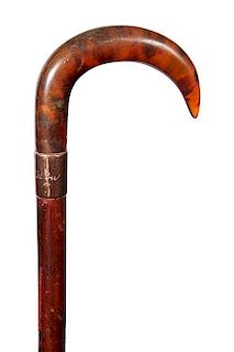 174. Dress Cane- Ca. 1930- A molded faux tortoiseshell handle, rose gold collar which is inscribed “George Allan” (small 
