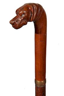 178. Dog Folk Cane- Ca. 1900- A carved walnut handle of a peaceable dog with two color glass eyes, gold-filled collar, hardwo