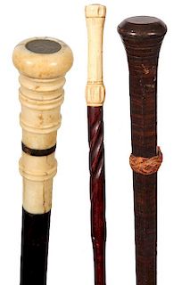 182. Three Dress Canes- Late 19th Century- Two are bone and the other is a stacked leather washer cane, A.L.- 35” $150-300